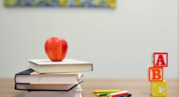 Photo by Element5 Digital red apple fruit on four pyle books