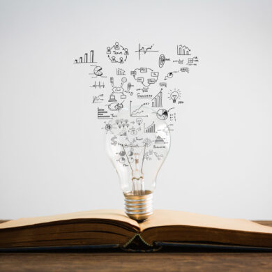 Book and light bulb of business concept